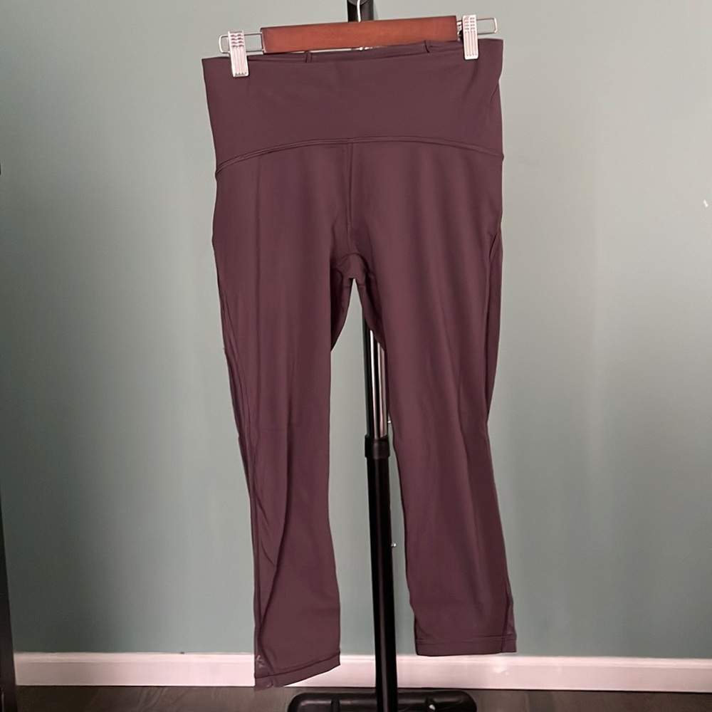 Lululemon purple capri running leggings in size 8. Has back pocket to store ID.
